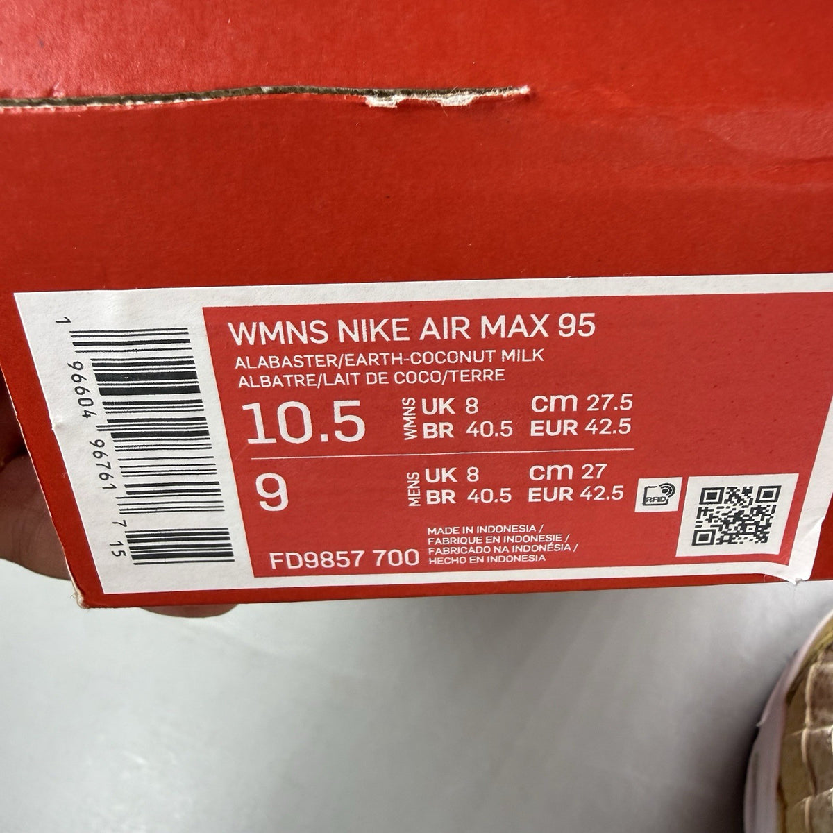 Nike Air Max 95 trainers yellow with textured upper and signature swoosh logo.
