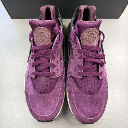 Nike Air Huarache trainers in purple with light bone accents and white sole.