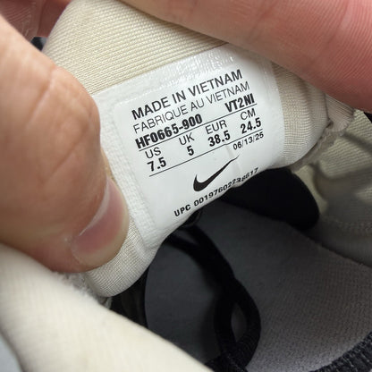 Nike Air Max Plus TN white trainers with black and purple accents, custom writing on bubbles.