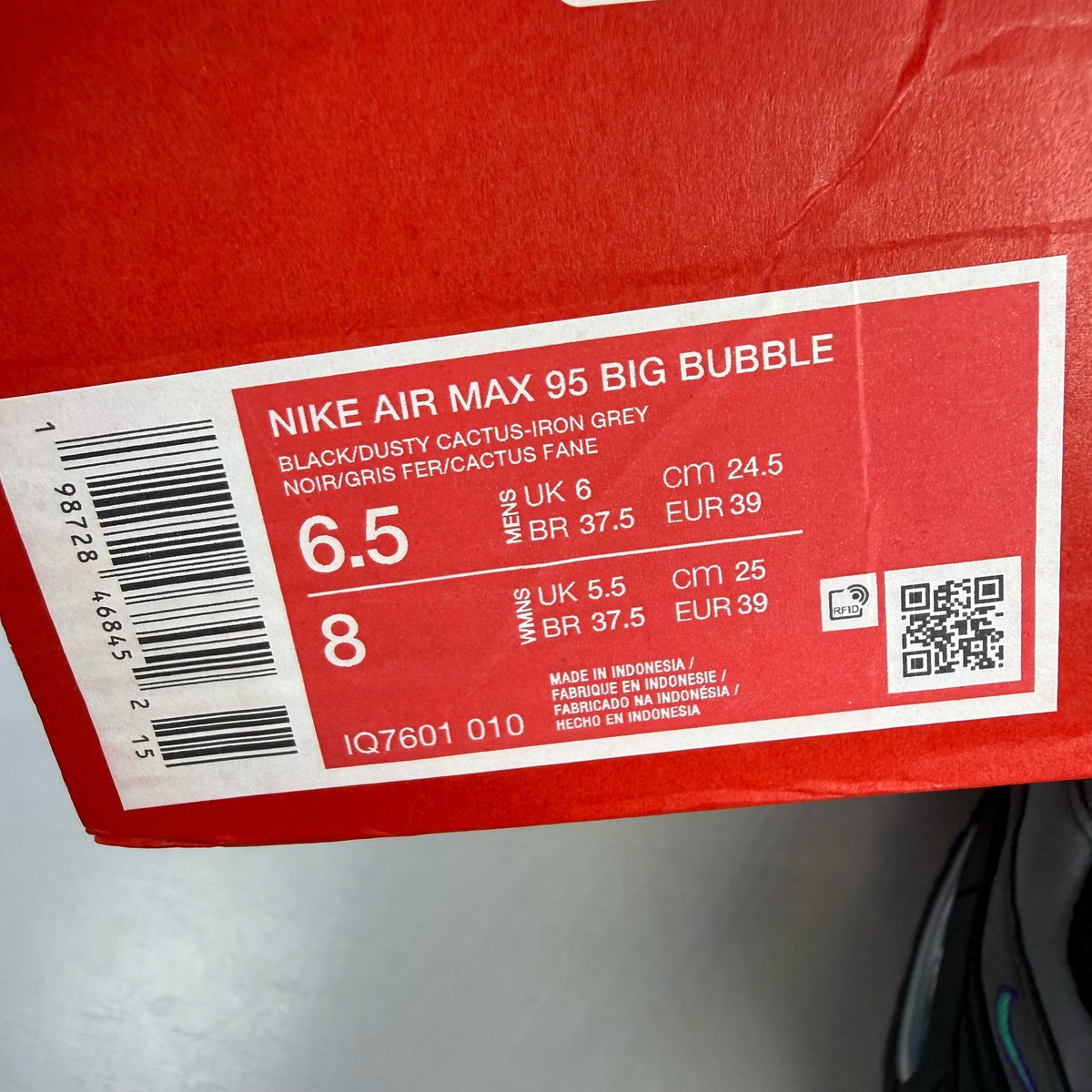 Nike Air Max 95 black trainers with big bubble design and multi-coloured accents.