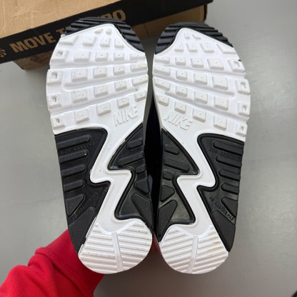 Nike Air Max 90 white athletic shoes featuring double swoosh logo and sleek design.