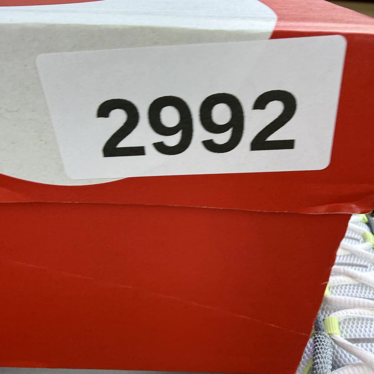 Nike Air Max Plus TN grey trainers with white and liquid lime accents, logo detail.