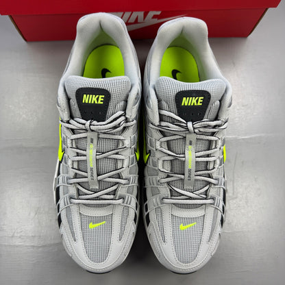 Nike athletic shoes grey with black and volt accents, mesh upper and logo detail.