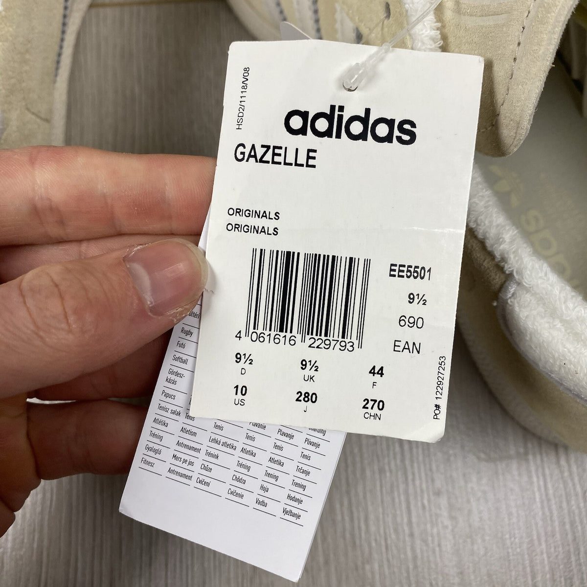 Adidas Gazelle trainers ecru tint with white stripes and suede upper material.