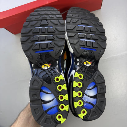 Nike trainers black with yellow heat map pattern and signature swoosh logo.