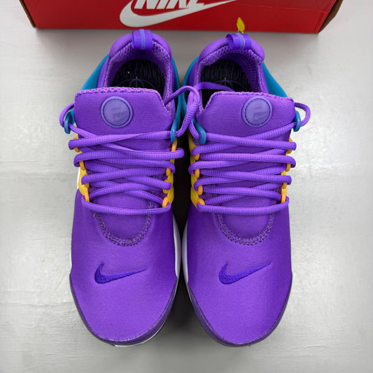 Nike Air Presto purple trainers with mesh upper and bold branding details.