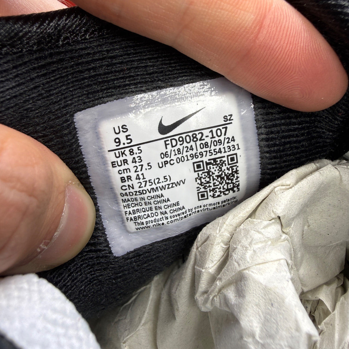 Nike trainers white with black and platinum grey accents, featuring iconic swoosh logo.