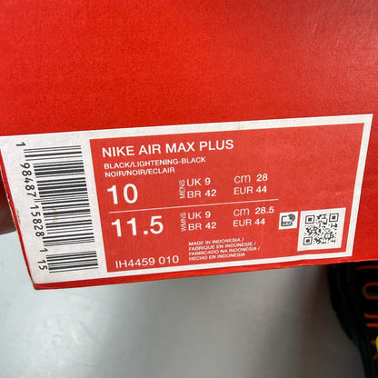 Nike Air Max Plus TN black trainers with signature logo and vibrant sunrise detailing.