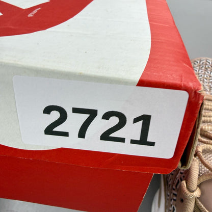 Nike Air Max Plus TN beige trainers with iconic logo and sleek design.