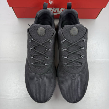 Nike Presto Fly black trainers with dark grey accents and logo detail.