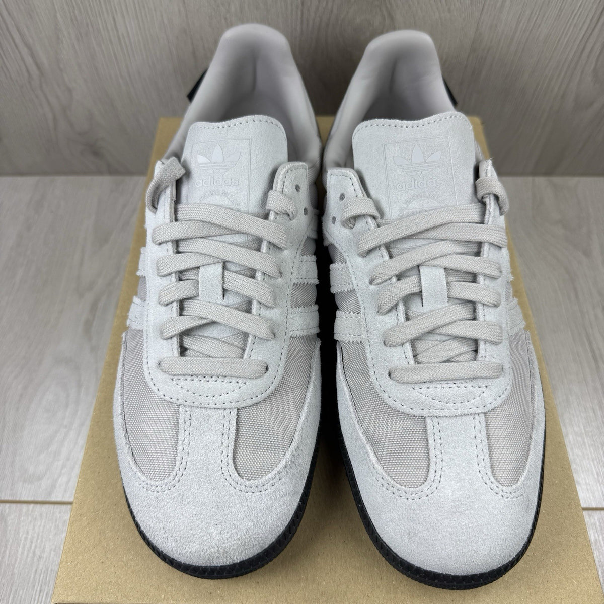 Adidas grey trainers with Cordura material and classic Samba logo detailing.
