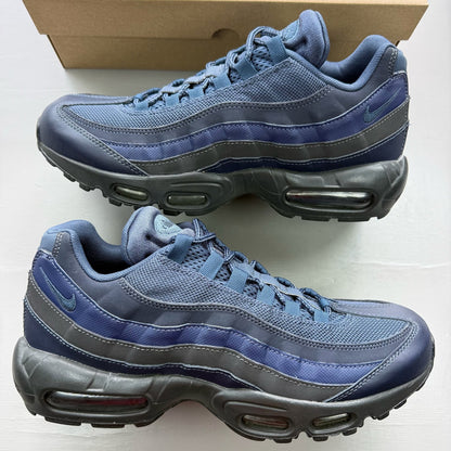 Nike Air Max 95 blue trainers with midnight navy accents and signature logo details.