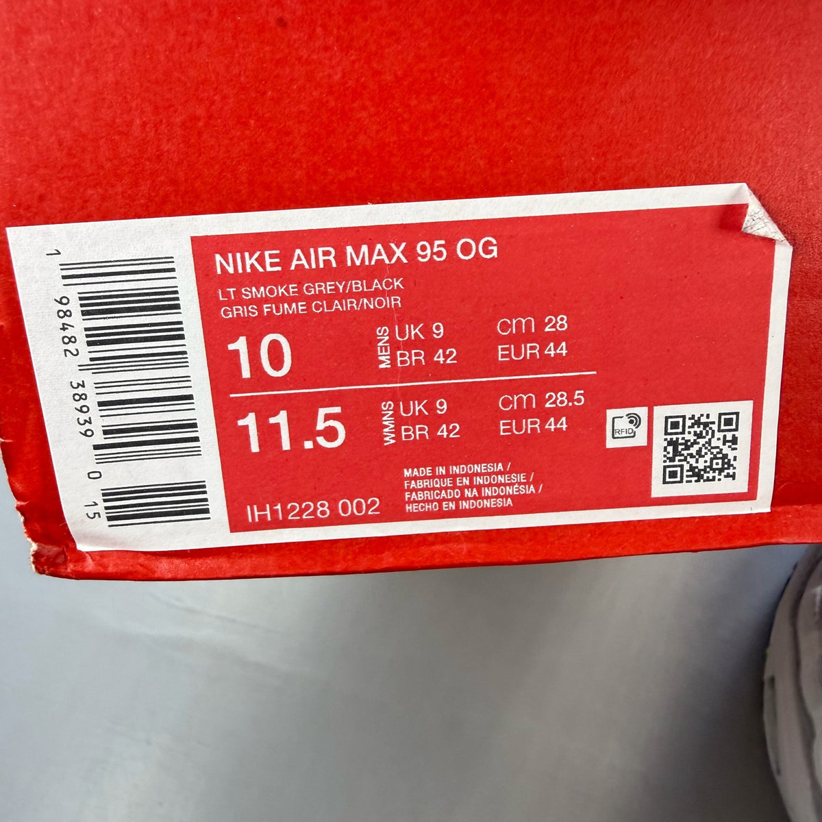 Nike Air Max 95 grey sneaker with big bubble sole and racing pack details.