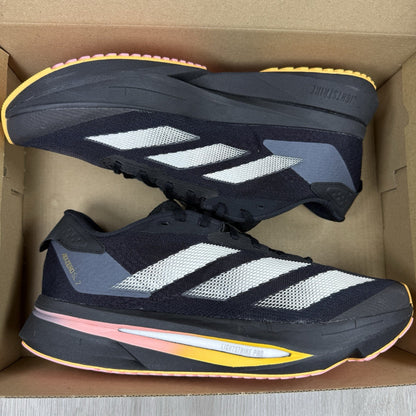 Adidas black trainers with white accents and distinctive Adizero branding.