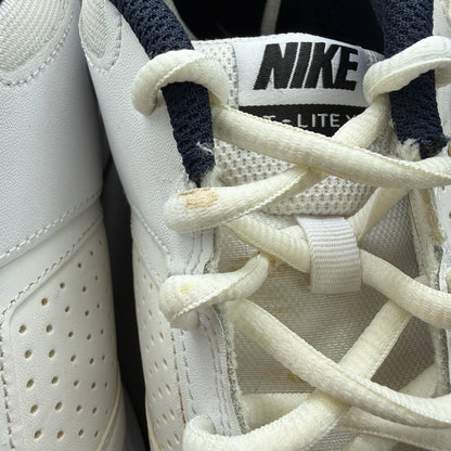 Nike T-Lite XI white trainers with obsidian and black accents, featuring a sleek design.