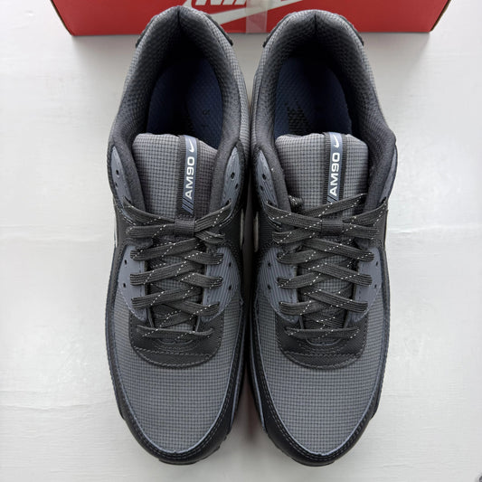 Nike Air Max 90 black sneaker with reflective silver accents and logo details.