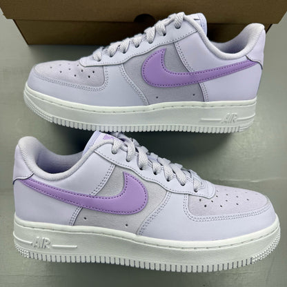 Nike Air Force 1 '07 purple trainers with classic white sole and logo detail.