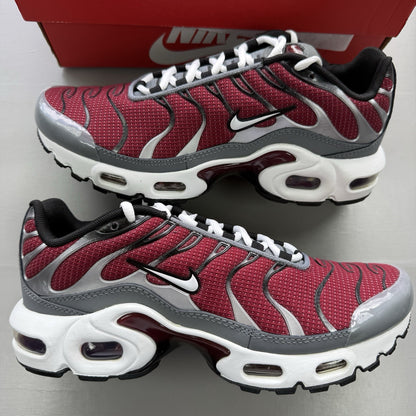 Nike Air Max Plus TN red trainers with grey and black accents, featuring signature logo.