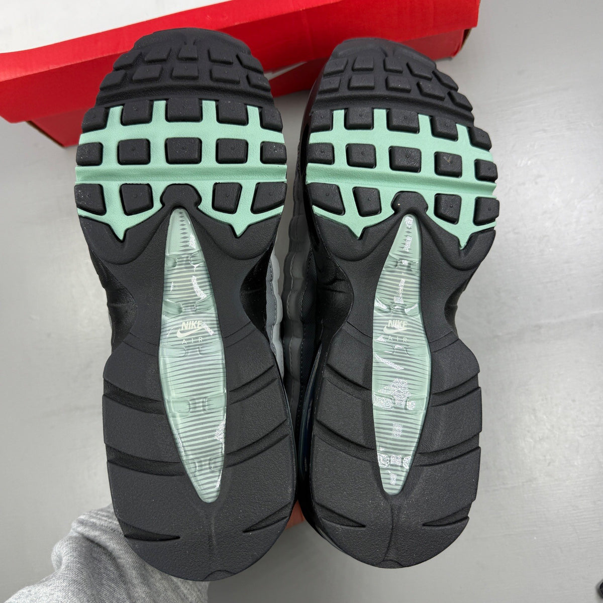 Nike running shoes grey with big bubble design and classic swoosh logo.