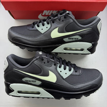 Nike Air Max 90 black trainers with Gore-Tex material and honeydew accents.