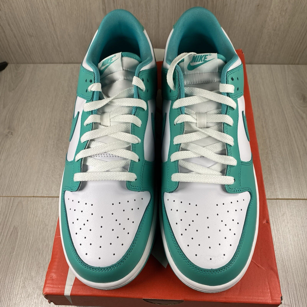Nike Dunk Low trainers white with clear jade accents and signature swoosh logo.