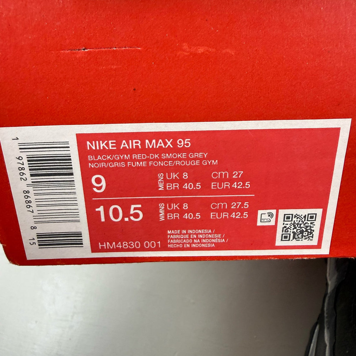 Nike Air Max 95 black trainers with Liverpool FC logo and big bubble sole.