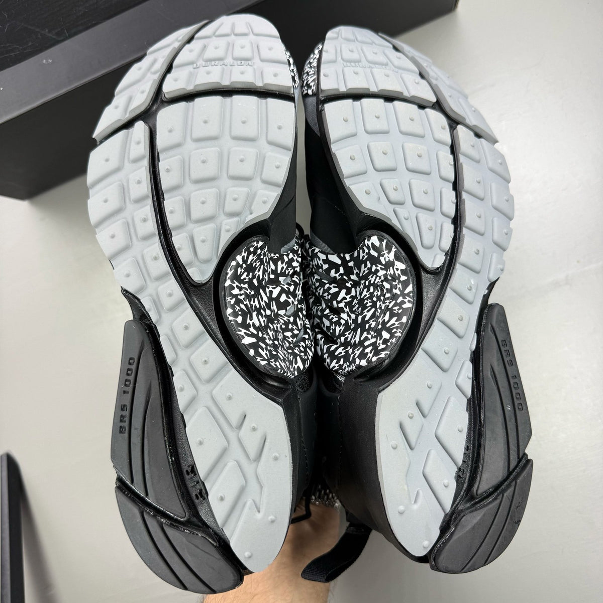 Nike black trainers with Cool Grey accents and Acronym logo details.