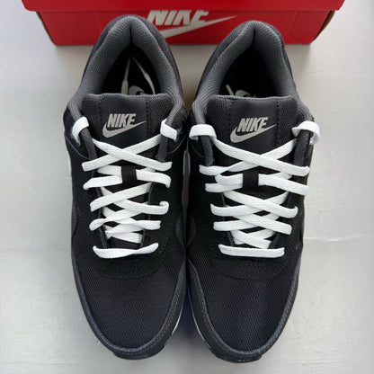 Nike Air Max 1 black trainers with silver and white accents, featuring iconic logo.