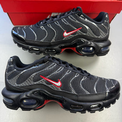 Nike Air Max Plus TN black trainers with university red accents and visible logo details.