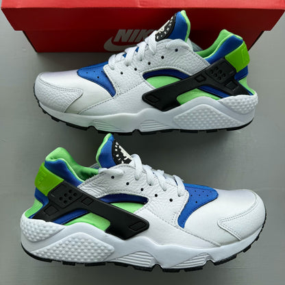 Nike Air Huarache white trainers with scream green and blue accents, mesh material.