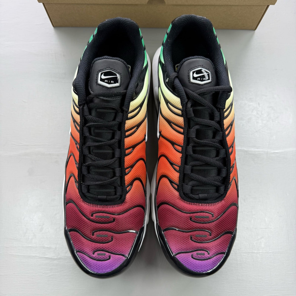 Nike black trainers rainbow gradient design with Viotech accents and Air Max cushioning.