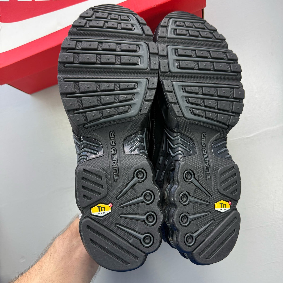 Nike Air Max Plus TN 3 black leather trainers with distinctive wave pattern and logo.