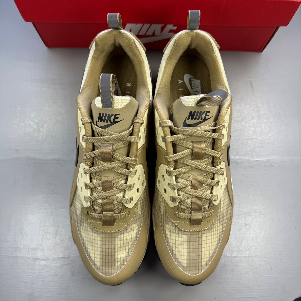 Nike Air Max 90 beige sneakers with black accents and khaki details.