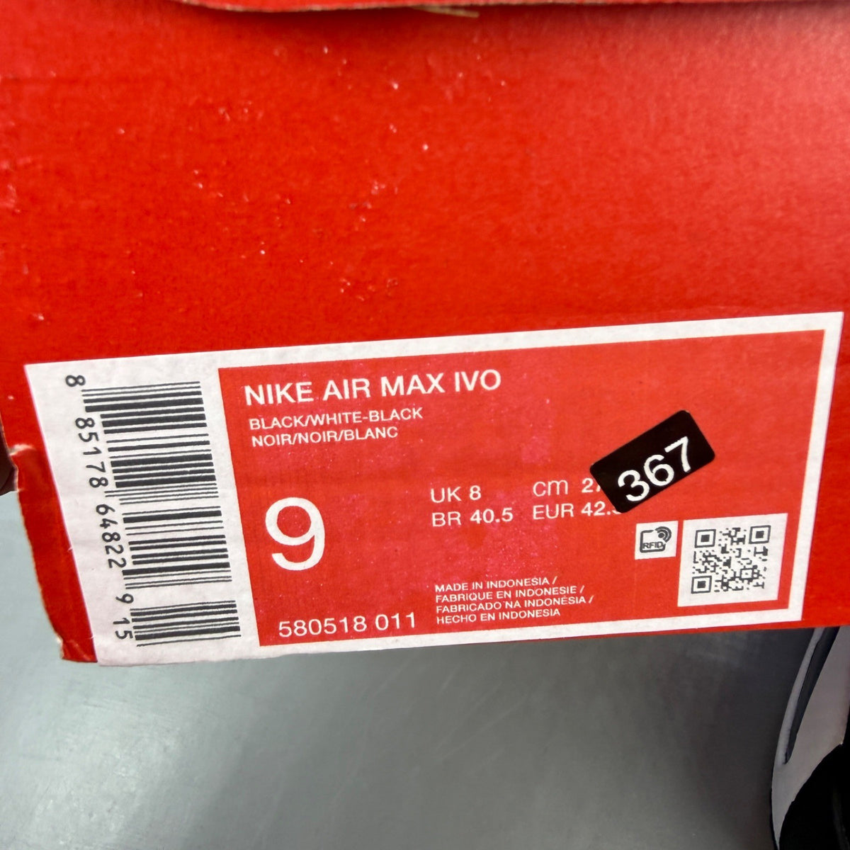 Nike running shoes black and white, featuring classic logo and sleek design.