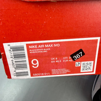 Nike running shoes black and white, featuring classic logo and sleek design.
