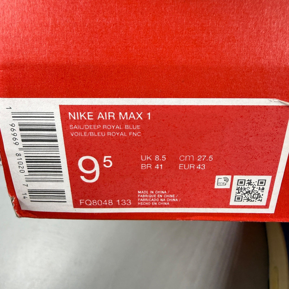 Nike athletic shoes royal blue with white swoosh logo and mesh detailing.