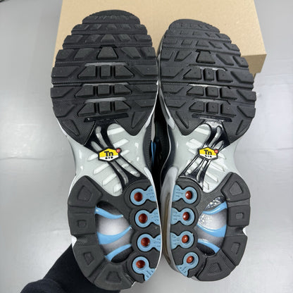 Nike Air Max Plus TN trainers white iridescent finish with signature swoosh logo.