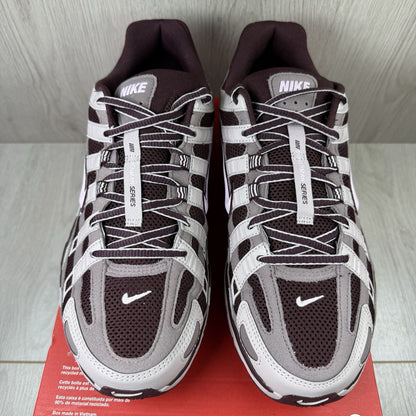 Nike P-6000 trainers purple with pink accents and mesh material detailing.