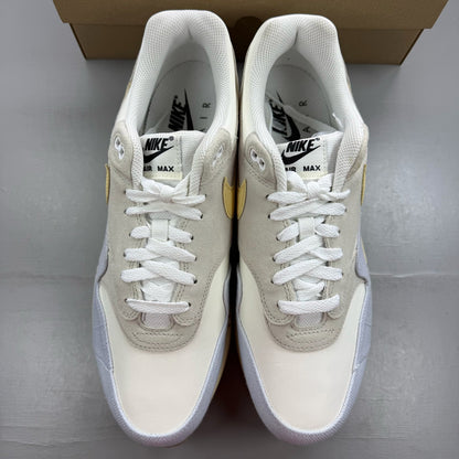 Nike Air Max 1 87 trainers beige with crepe sole and subtle logo detail.