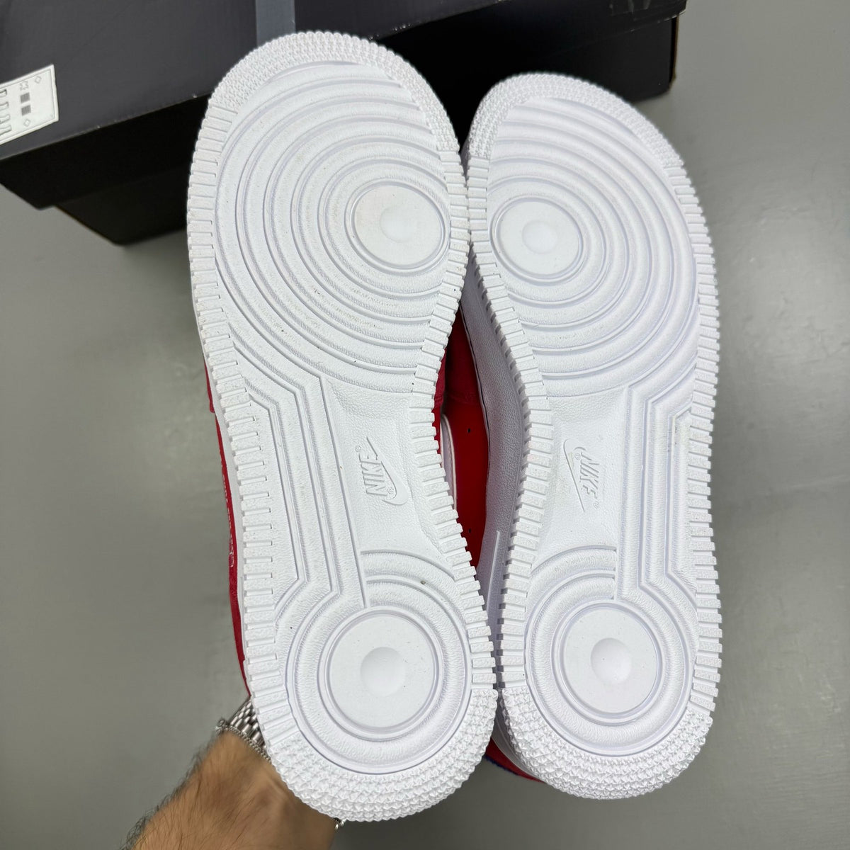 Nike Air Force 1 '07 LV8 red sneakers with iconic swoosh logo and premium material.