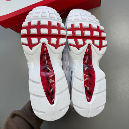 Nike trainers white with red accents and big bubble sole design.