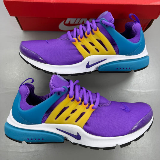 Nike Air Presto purple trainers with mesh upper and distinctive logo detailing.