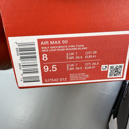 Nike Air Max 90 white trainers with pink foam accents and grey detailing.