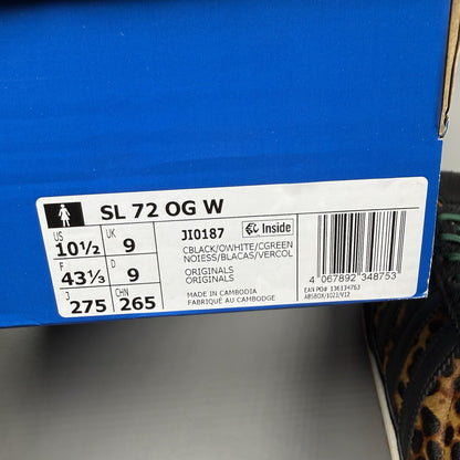 Adidas black trainers with leopard print accents and classic three-stripe logo.