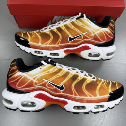 Nike Air Max Plus TN trainers in light photography orange with distinctive wavy design.