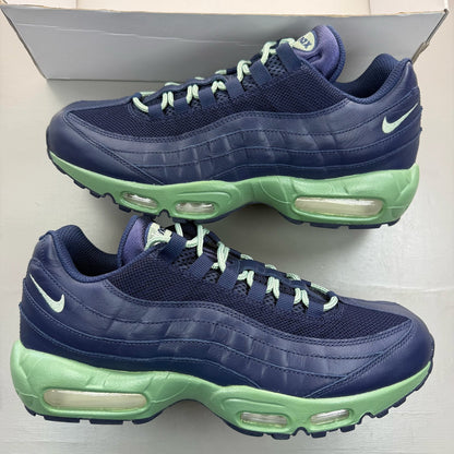 Nike Air Max 95 navy blue trainers with green accents and classic logo detailing.
