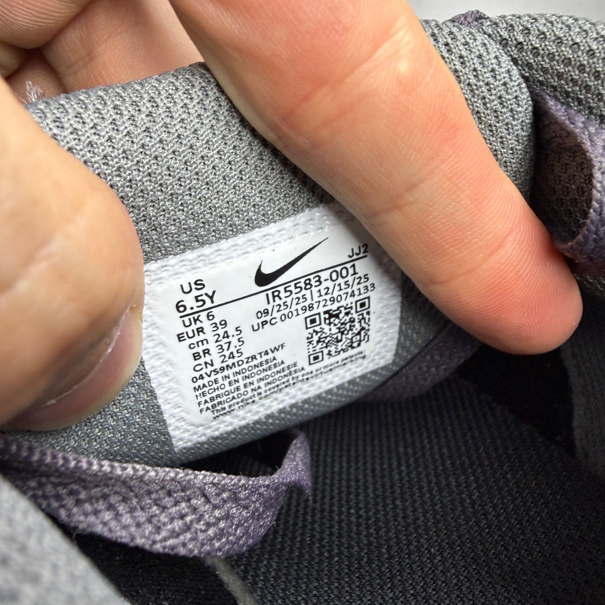Nike Air Max 90 Tech grey trainers with blue accents and logo detail.