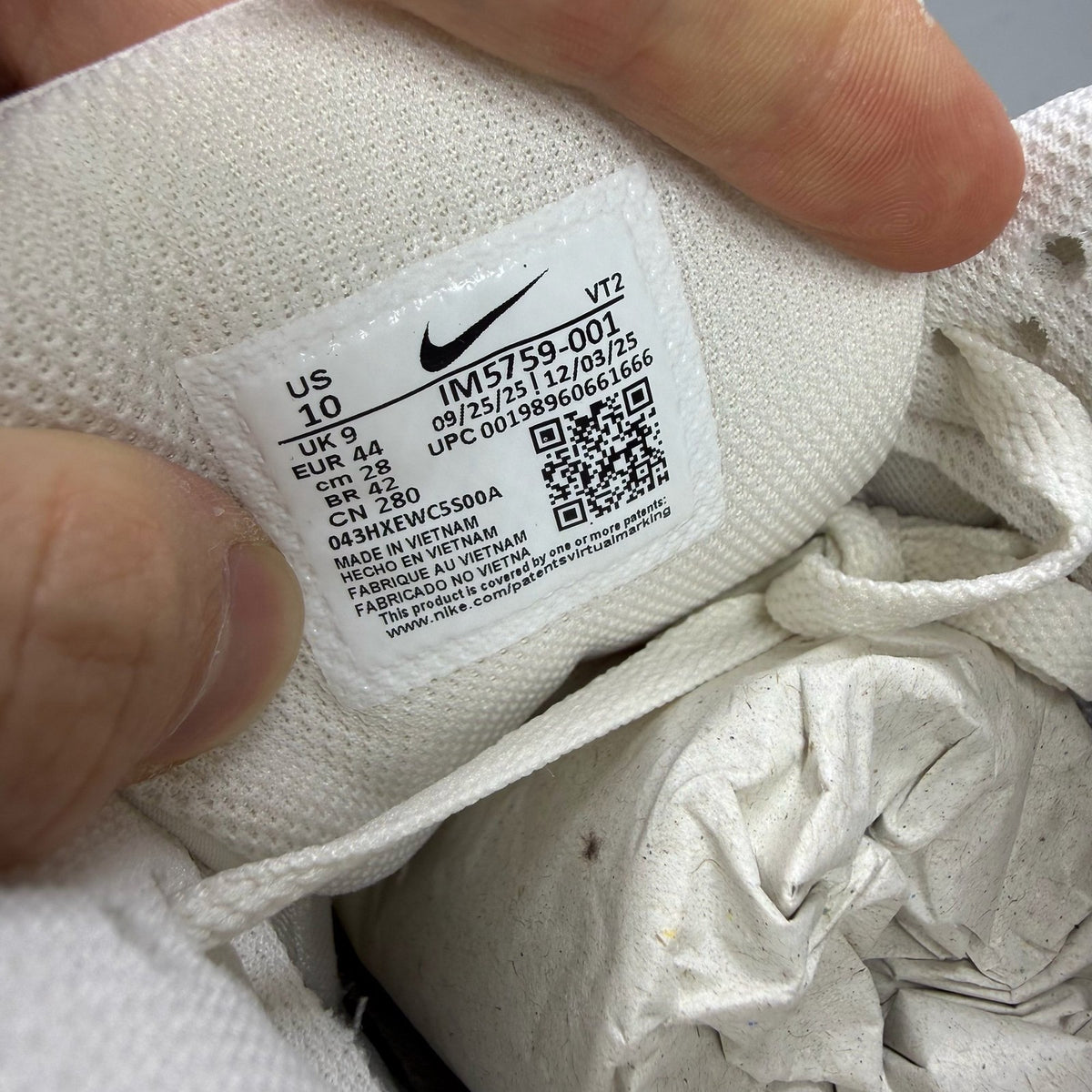 Nike Air Max 90 beige trainers with premium material and iconic logo detail.
