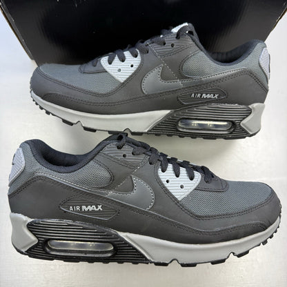Nike Air Max 90 black trainers with anthracite and cool grey accents, iconic logo.