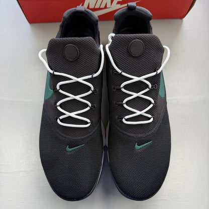 Nike Presto Fly black trainers with grey accents and white sole, featuring logo details.